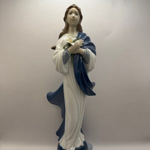 Lladro Glossy porcelain figurine of Virgin Mary w/lilies on a globe.